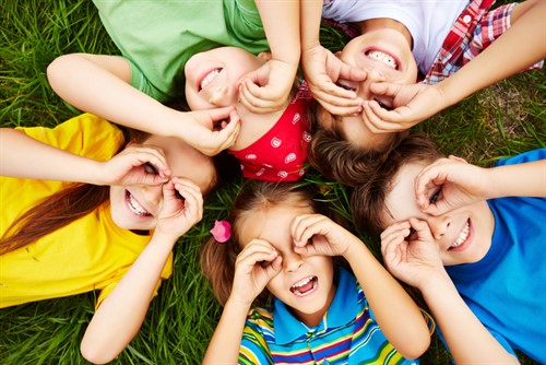 Children Playing On Grass