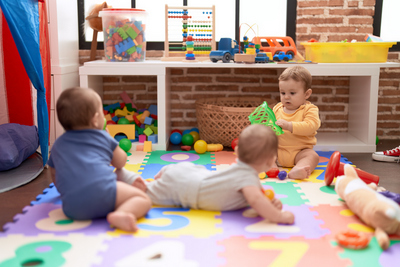 Group Toddlers Playing With Toys Crawling Floor Kindergarten